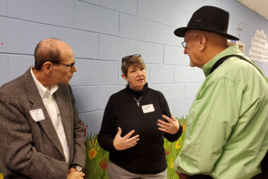 Cindy Corell (center) shares her eperiences in Haiti with attendees at the October 2019 presbytery meeting.